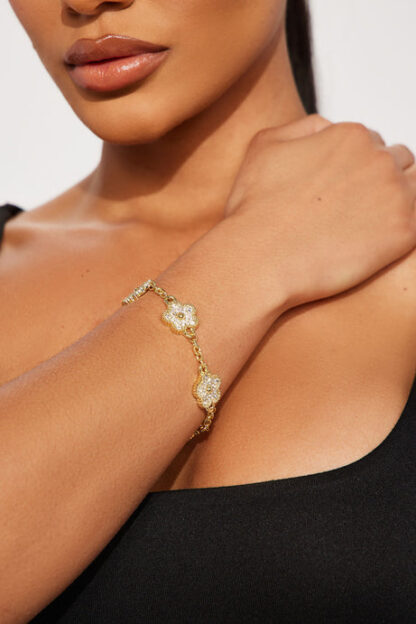 Pulsera con Detalles Florales y Piedras de Strass - Dorado